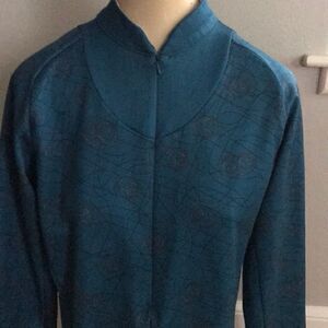 Nike teal/patterned 1/2 zip bike style jacket, med